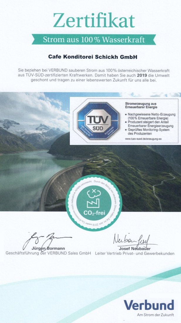 Zertifikat „Strom aus 100 % Wasserkraft“ der VERBUND Sales GmbH für die Cafe Konditorei Schickh GmbH mit TÜV-SÜD-Siegel und CO₂-frei-Stempel